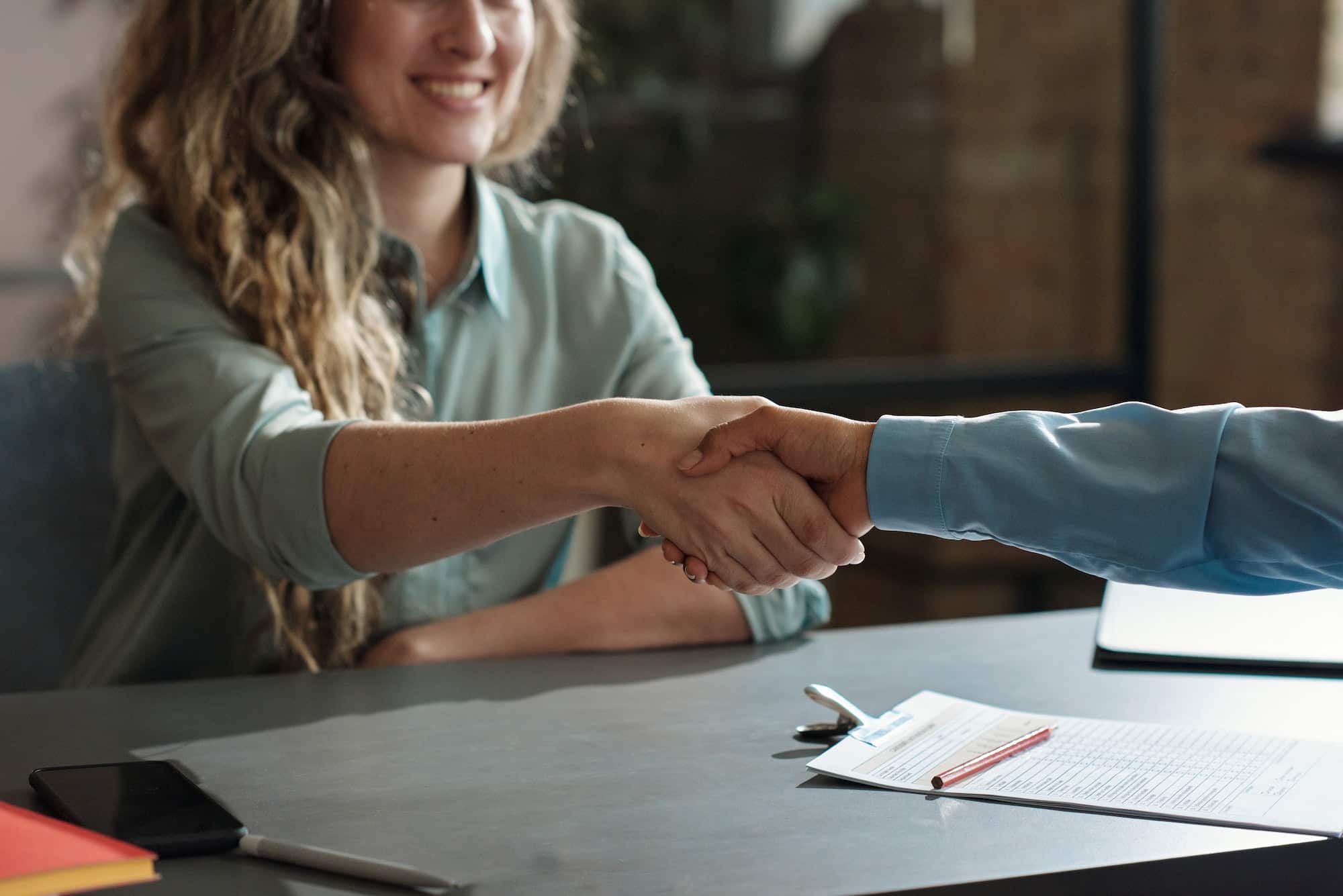 Happy woman being hired for a new job